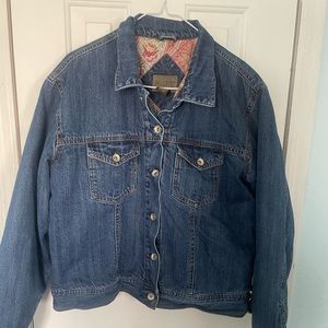 A puffy denim jacket with a cool design on the inside
